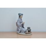 A Lladro figurine, of a Japanese Lady drinking tea, 22cm H, together with the retail box