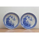 A pair of large late 19th century Chinese blue and white chargers, depicting birds in natural