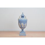 A 20th century Wedgwood Jasperware twin handled lidded urn, blue and white, impressed marks 1972
