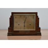 An oak cased art deco style mantle clock, rectangular dial, with a plaque beneath, 22cm H x 32cm W