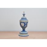 A 20th century Wedgwood tricolour Jasperware urn and cover, from the 'Masterpiece Series', impressed