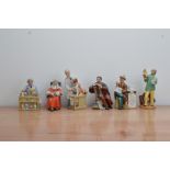 Six Royal Doulton ceramic figurines, comprising, Punch and Judy man H.N.2765, Stop Press H.N.