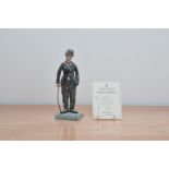 A limited Edition Royal Doulton figure of Charlie Chaplin, no, 2,314 of 5,000, together with the