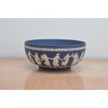 A 20th century Wedgwood Jasperware 'Dancing Hours' bowl, Portland blue, impressed marks for 1977