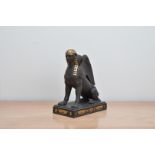 A Wedgwood Gilded Black Basalt Sitting Sphinx, limited edition no. 63 of 100 marked to the base in