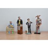 Four Royal Doulton ceramic figurines, comprising, The China Repairer H.N. 2943, The Auctioneer H.