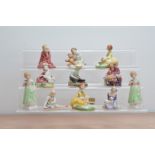 11 Royal Doulton ceramic figurines, including two figurines of Tess H.N. 2865, Picnic H.N. 2308, and