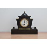 An Art Deco style mantle clock, domed top mounted with a brass finial, white enamel dial with