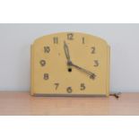 An Art Deco style clock face by Pekola, key present, 20cm H x 25cm W