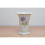 A late 19th century porcelain Meissen trumpet vase, floral design with gilt rims, marked to the