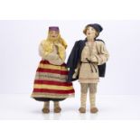 Two Soviet Union stockinette dolls, a Willage Boy with painted features, traditional costume with