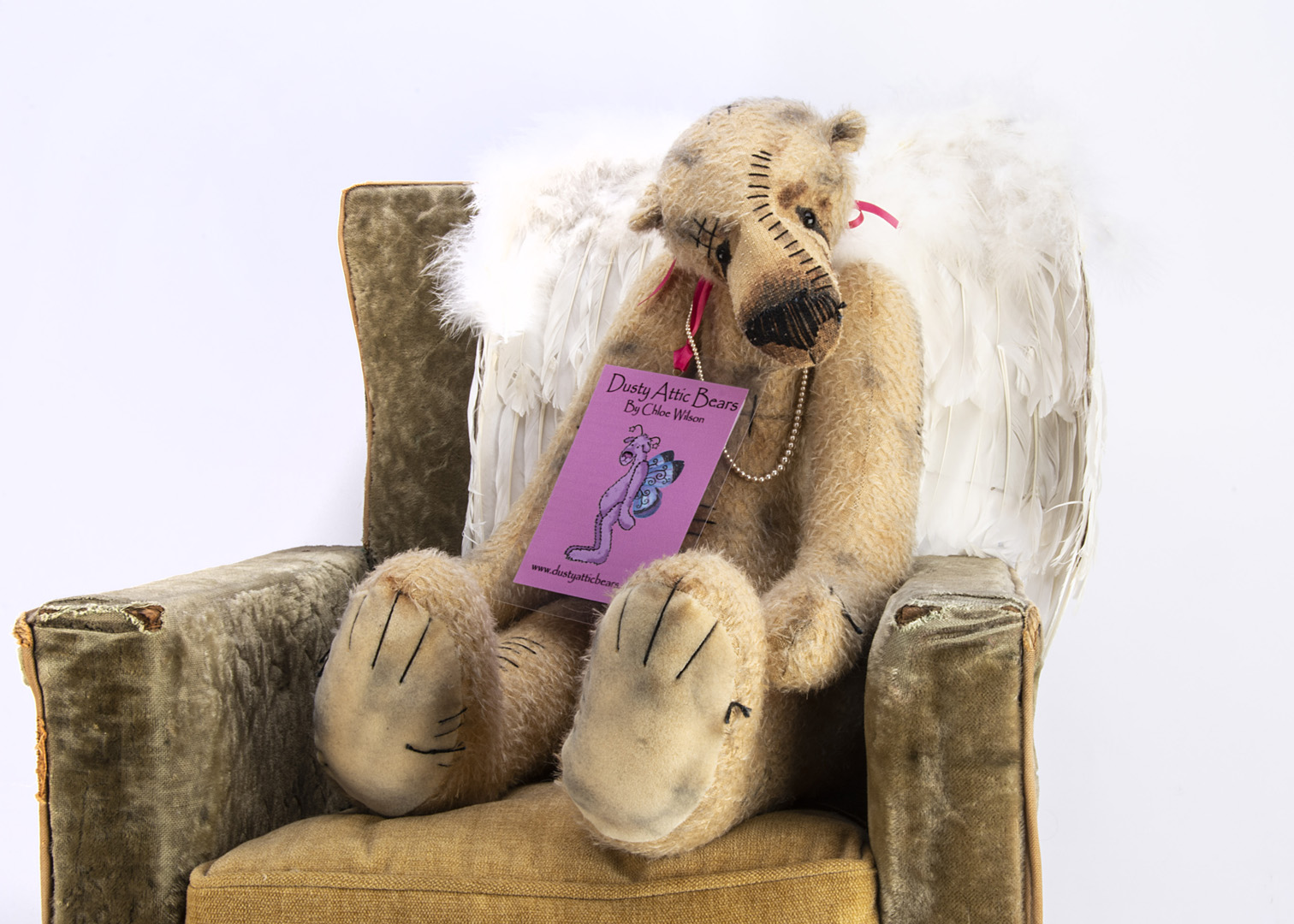 A Dusty Attic Bears Darcey artist teddy bear, with feather wings, designed by Chloe Wilson, with