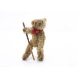 A World War One larger size Soldier teddy bear, with golden mohair, large black headed glass pin