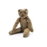 A World War One larger size Soldier teddy bear, with blonde mohair, black headed glass pin eyes,