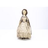 A fine and unusual late 18th century English carved and painted wooden doll, with inset dark
