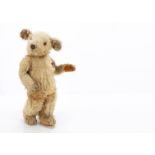 A rare Merrythought Bobby Bruin teddy bear circa 1935, with golden mohair, replaced orange and black