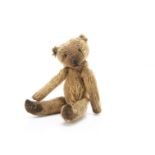 A World War One larger size Soldier teddy bear, with golden mohair, black headed glass pin eyes,