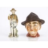 A German porcelain Boy Scout tobacco jar, with lift off wide brimmed hat and 'Be Prepared' incised