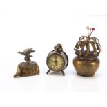 Three novelty tape measures, a brass flower pot with spinning flowers —3in. (7.5cm.) high; a duck