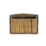 A Charles Tilt mid 19th century My Own Library leather bookcase of small children's books, twelve