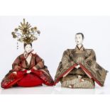 A Hinamatsuri gofun seated Emperor and Empress, with inset glass eyes, original robes, her with