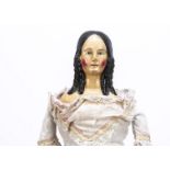 A German first half of 19th century pâpier-maché shoulder head lady doll, with blue painted upward