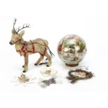 A Christmas internal glass découpage sphere, with Christmas and other scraps —4½in. (11.5cm.)