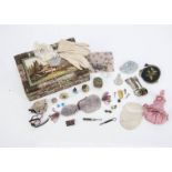 A group of doll’s accessories and collectable items, a doll’s leather purse and two bonnets; a