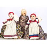 Three Russian cloth Babushka coffee or tea cosies, with painted faces, two gossiping peasants, one