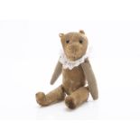 A World War One larger size Soldier teddy bear, with blonde mohair, large black headed glass pin