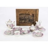 A mid 19th century porcelain doll's tea set in original box, six cups, five saucers, teapot, sugar