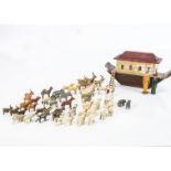 A small Erzgebirge Noah’s Ark and animals, stained wooden hull, cream upper with red roof and