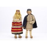 Two Soviet Union stockinette dolls, a Willage Boy with painted features, traditional costume with