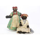 Two black cloth Mammy dolls, a stockinette example with stitched features and bead pupil, stuffed