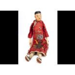 An unusual large Chinese pâpier-maché Chinese Opera type male doll, with painted features, stuffed