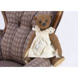 A small Forget Me Not Bessie Brown teddy bear, 1 of 1 with card tag April 2002 , artifically