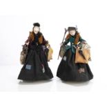 Two amusing artist doll Victorian bag ladies, with painted wooden heads, wool hair, detailed clothes