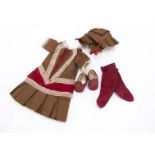 A small late 19th century doll’s outfit, brown dress with red silk satin, lace and gold braid