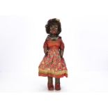 An unusual pâpier-maché shoulder head brown doll, with brown painted eyes, broad nose and full