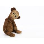 A very rare Merrythought Teddy Doofings teddy bear circa 1937, with brown and white artificial