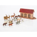 A very small Erzgebirge Noah’s Ark and animals, pink and red painted wooden flat-bottomed Ark with