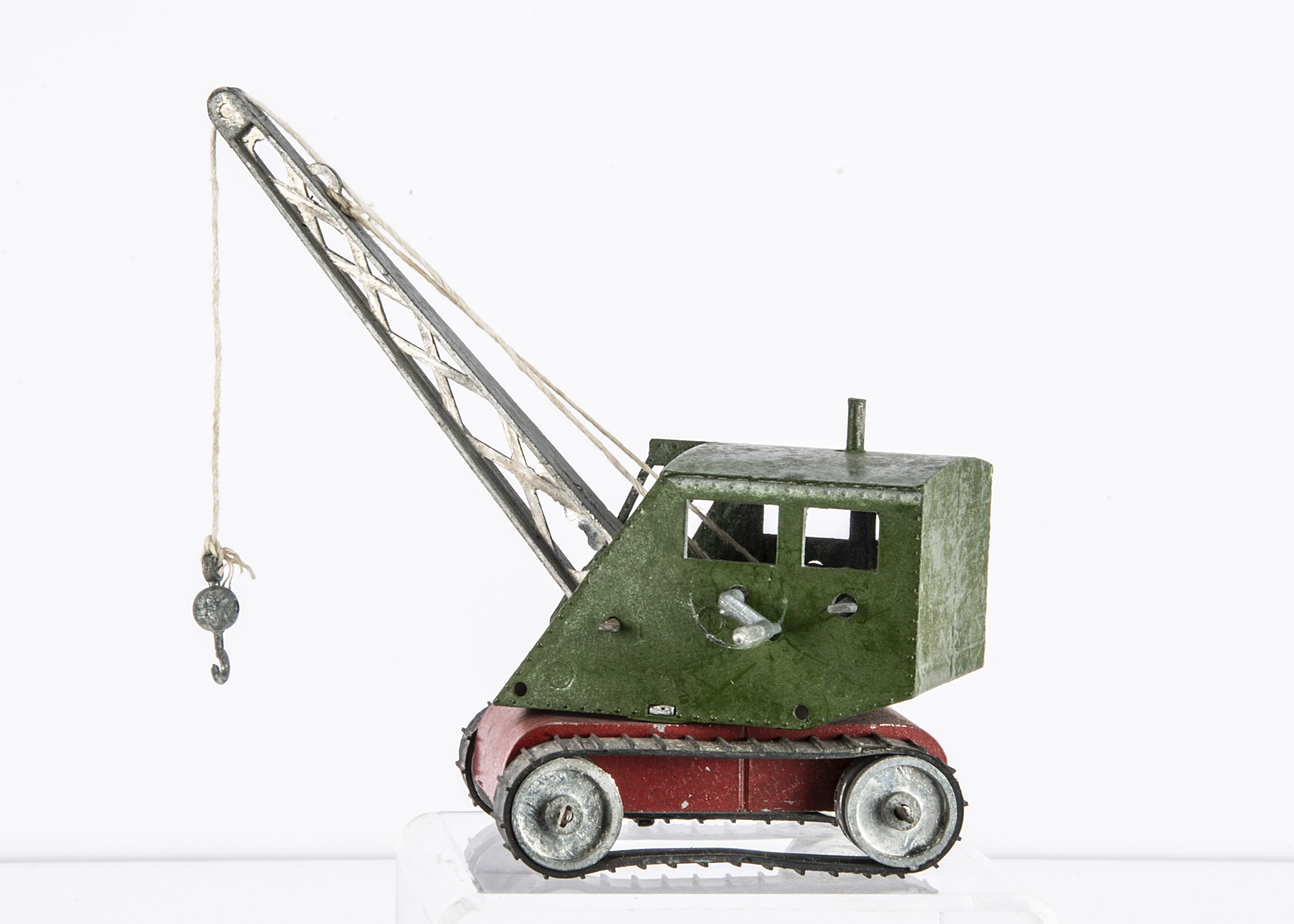 A Teeny Toy (Cleveland Toy Manufacturing) Mobile Crane, dark green cab, red base, bare metal jib,