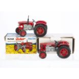 Maxwell Toys No.570 H.M.T Zetor Tractors, two examples, both red with silver chassis and black