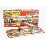 A Technofix No.306 Mystery Station Tinplate Clockwork Toy, comprising colourful railway station