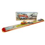 A Technofix No.297 Automatic Loader Tinplate Clockwork Toy, comprising fold out colourful train