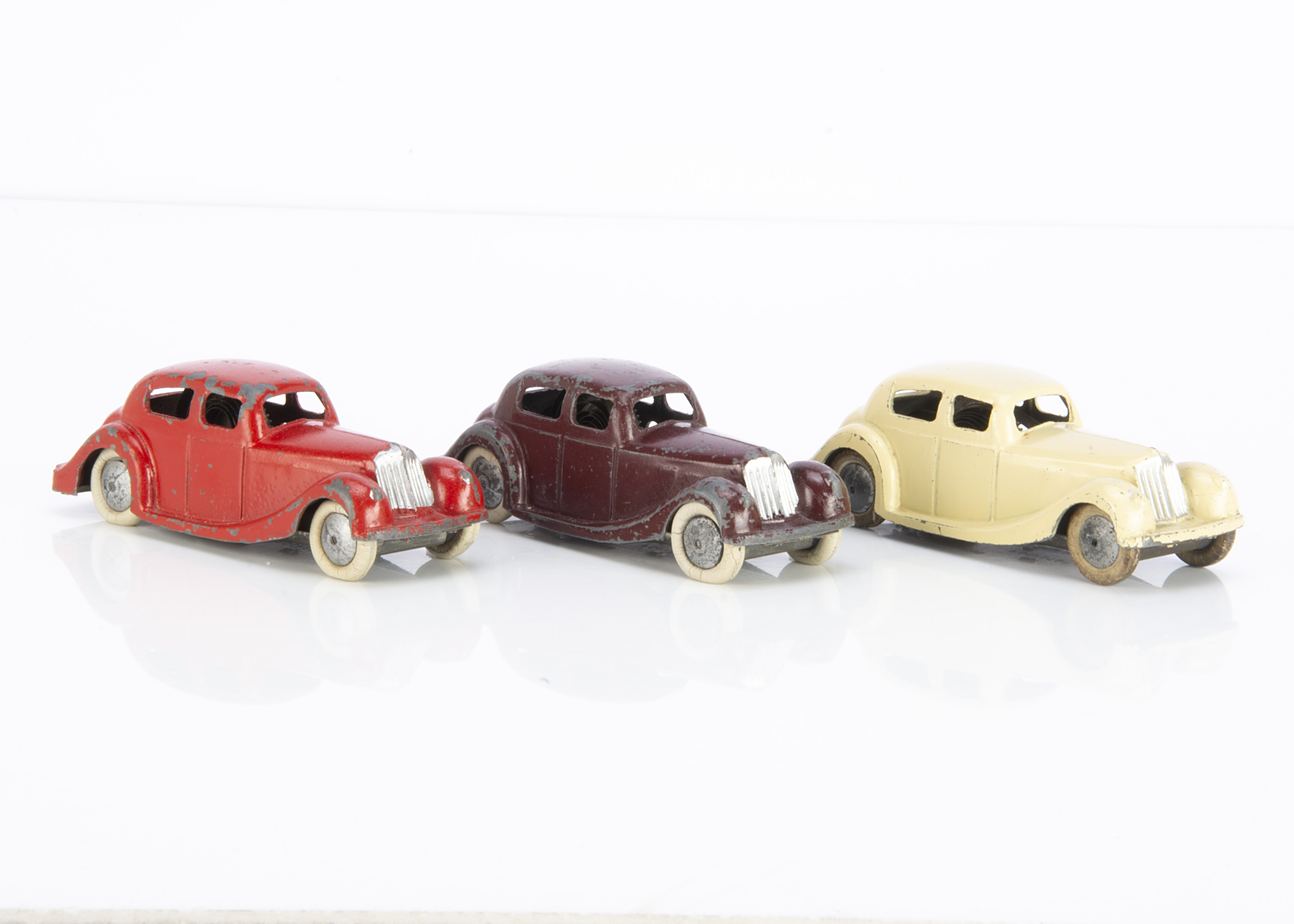 Brimtoy Pocketoy Clockwork No.502 Sunbeam Talbot, three examples, cream, red, maroon, all with metal