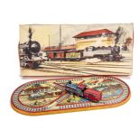 A Technofix No.275 Shunting Railway Tinplate Clockwork Toy, comprising colourful railway station