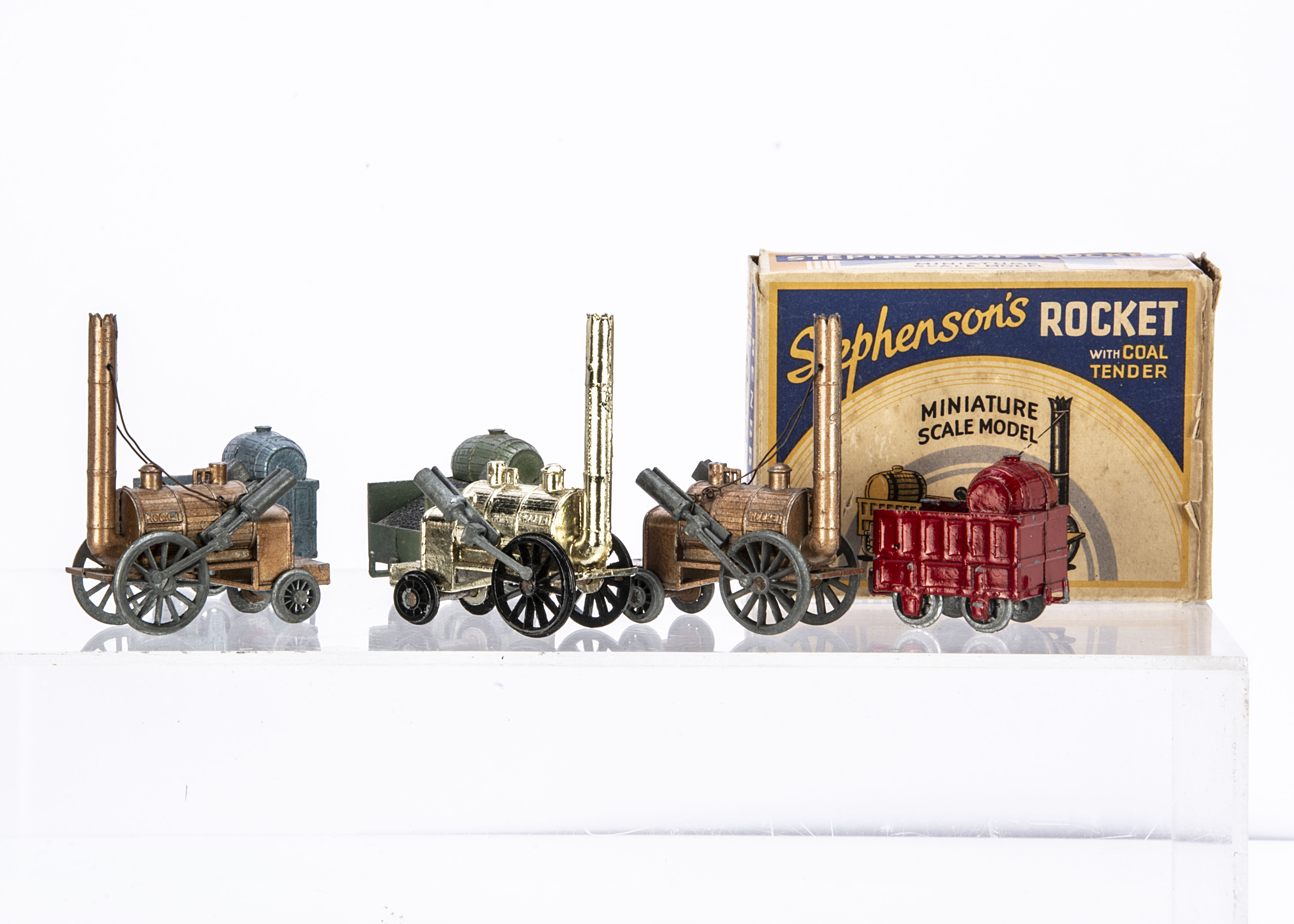 Benbros Qualitoy Stephenson's Rocket, three examples, bronze Loco, metallic steel blue Coal