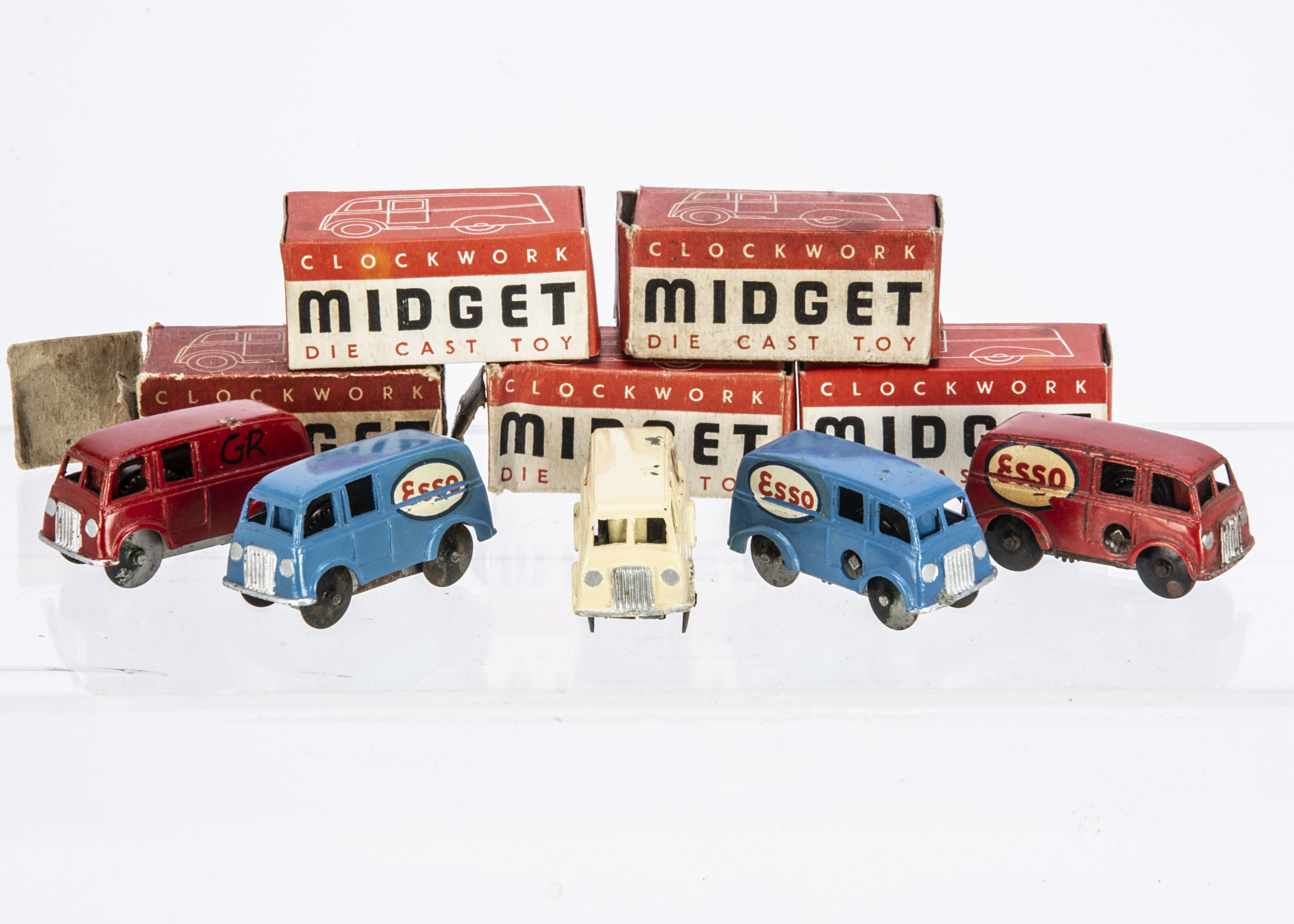 Chad Valley Clockwork Diecast Midget Vans, five examples, blue, 'Esso' decal (2), red, 'Esso' decal,