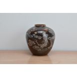 An early 20th century late Meiji period Japanese glazed earthenware ginger jar, with raised dragon